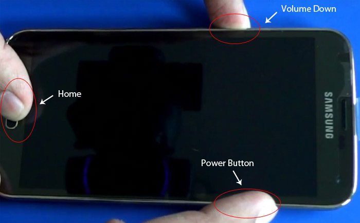 Press and hold Volume Down, Home and Power buttons